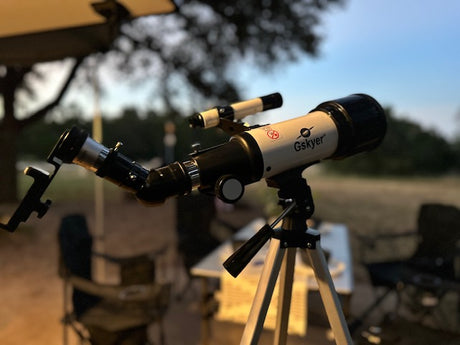 A Gskyer telescope is set for stargazing on an RV rental trip, ideal for celestial camping views.