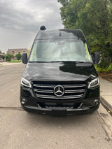 Front view of a black Mercedes-Benz Sprinter van, perfect for your next RV rental adventure.