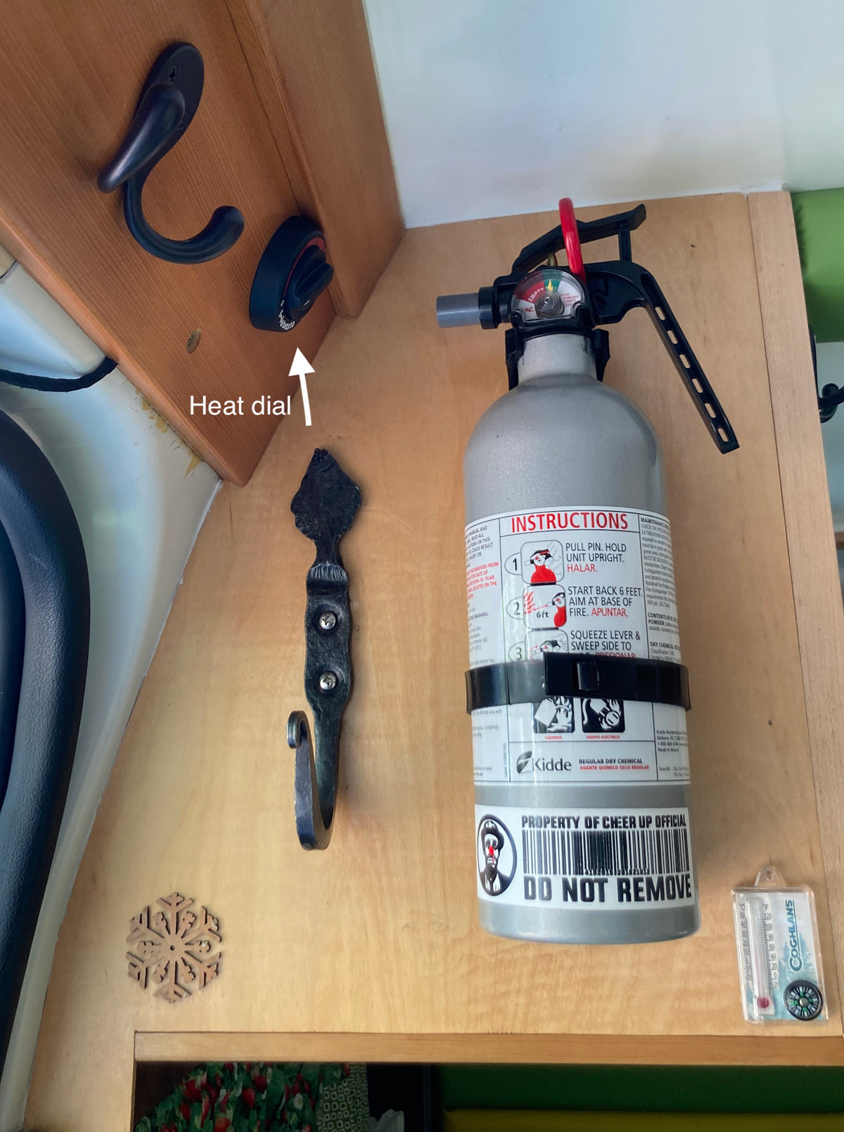Stay safe & comfortable in your RV rental with an accessible fire extinguisher, heat dial, and thermometer. — photo 10