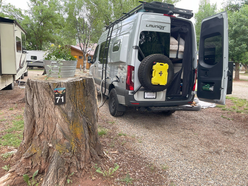  parked on a gravel desert road.|An RV rental offers stunning views of a vast desert lake — photo 4