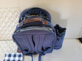 Blue picnic backpack with cutlery and blanket, ready for your RV rental adventure.