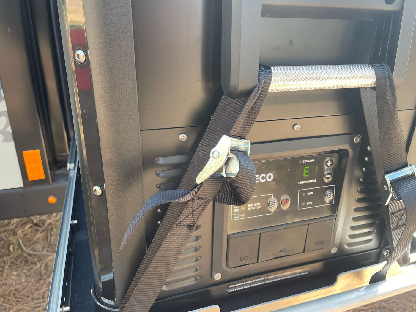  ideal for off-grid camping.|An RV rental's pull-out outdoor kitchen features a stove cooking — photo 10