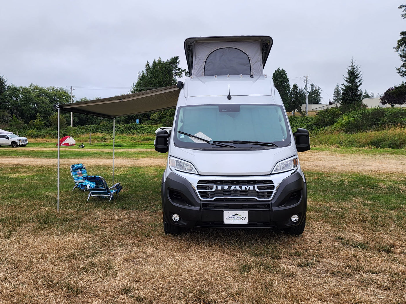 Silver camper van with pop-top roof & awning — photo 1