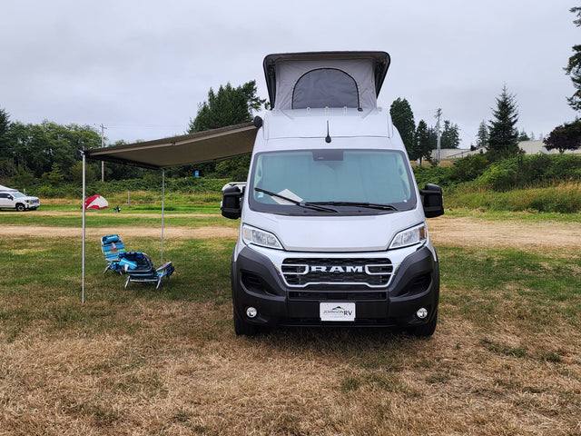 Silver camper van with pop-top roof & awning