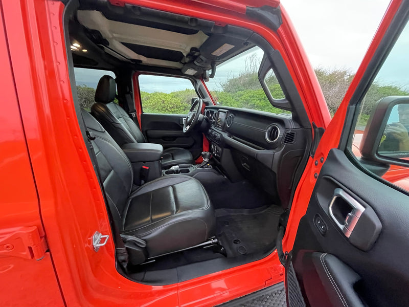  perfect for an adventurous RV rental camping trip.|Explore this bright orange Jeep interior — photo 25