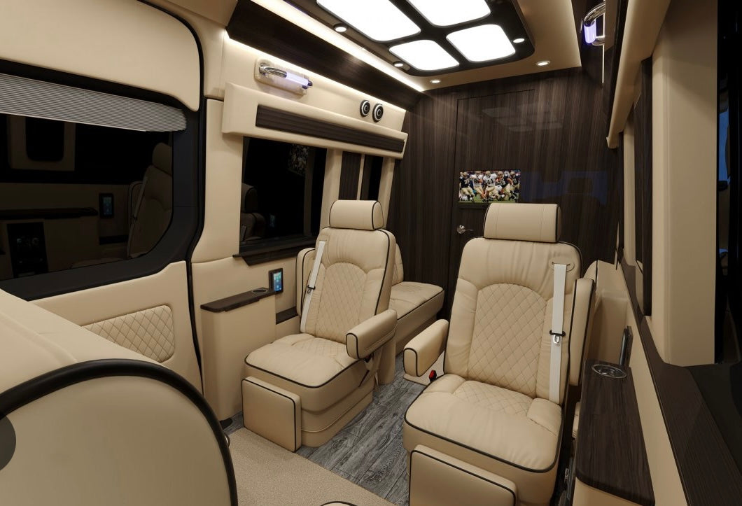 Relax in this luxurious rv rental interior with plush tan seats, dark wood paneling, and a TV, ideal for travel.