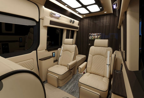 Relax in this luxurious rv rental interior with plush tan seats, dark wood paneling, and a TV, ideal for travel.