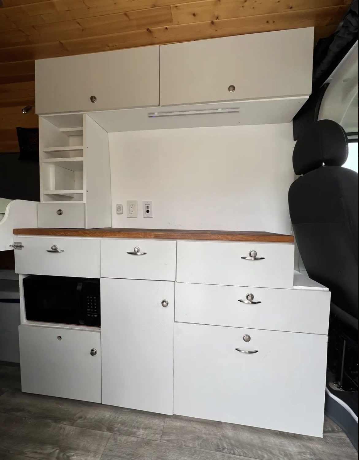  ready for travel adventures.|Serene RV rental camping by the water at sunset. A person relaxes with their dog while outdoor cooking beside their camper van.|RV rental for desert camping. A white camper van with an open door — photo 6