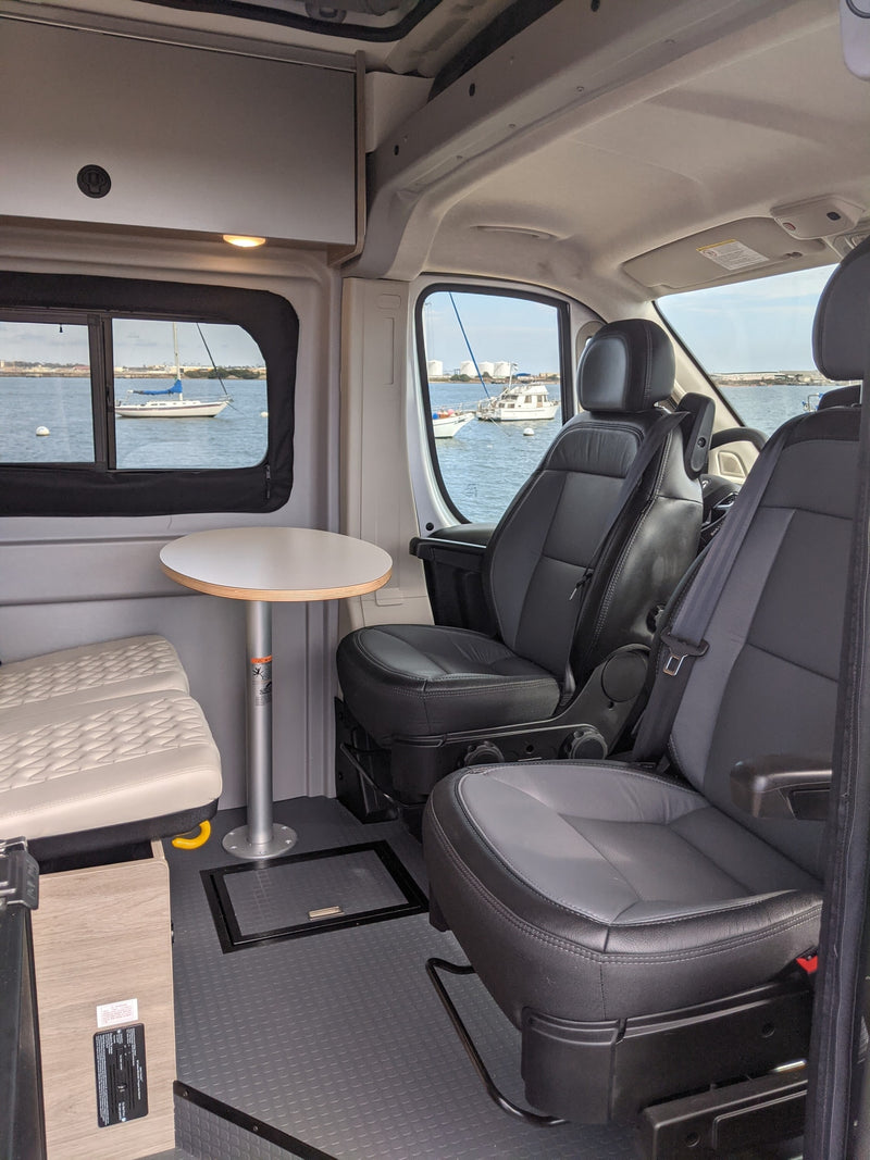  perfect for a California coastal adventure.|RV rental interior with swivel seats — photo 3
