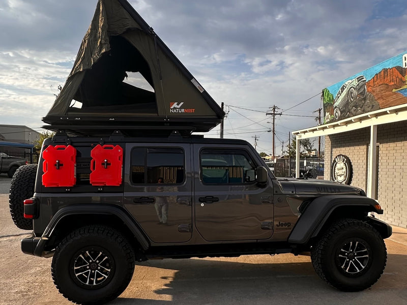  ready for **rv rental** and camping adventures.|RV rental ready Jeep Wrangler featuring an open NaturNest rooftop tent — photo 2