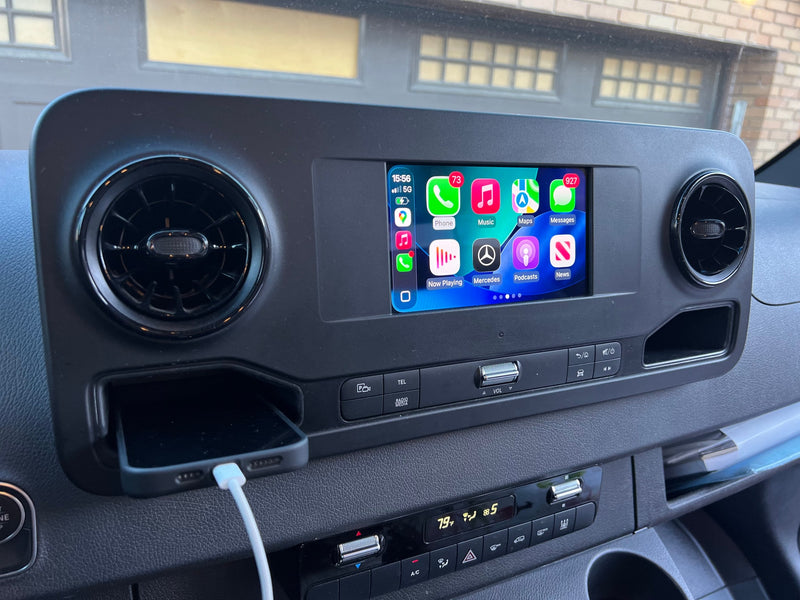 RV rental dashboard: Apple CarPlay on a Mercedes infotainment system, phone charging, and climate controls at 79°F. — photo 10