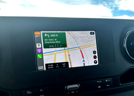 CarPlay navigation in an rv rental shows a left turn in 450ft to Charleston Blvd. Arrival is 8 mins & 3.5 miles away.