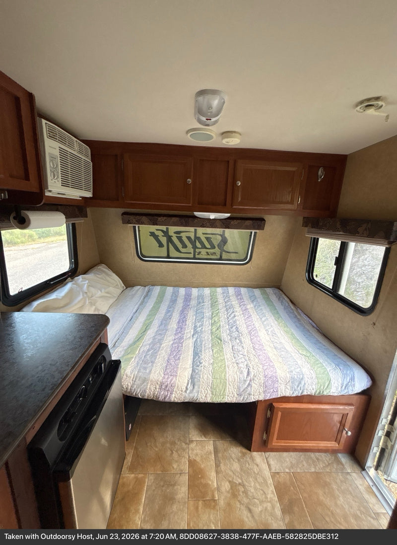  and a blue sky.|**RV rental kitchen & living area:** Features a sink — photo 4
