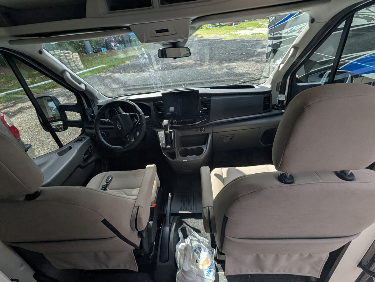  cabinets & fire extinguisher.|Cozy RV rental interior: Driver's seat — photo 2