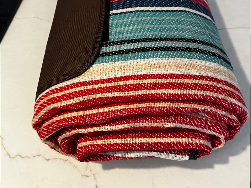  neatly stored in a wood-look cabinet for convenience.|Cozy RV rental bunk bed with striped bedding — photo 17