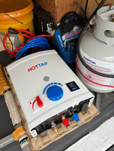 RV rental setup: Joolca HOTTAP portable water heater, AmeriGas propane tank, and power inverter for off-grid camping.
