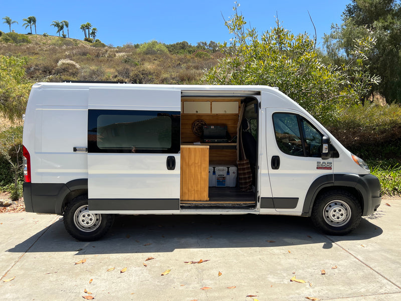 White Ram ProMaster camper van for RV rental, showing custom interior kitchenette. — photo 3