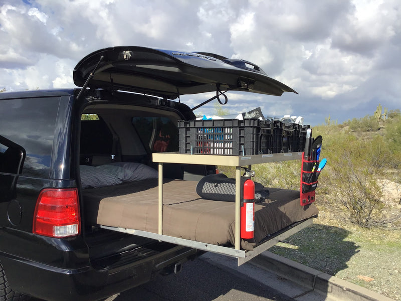 RV rental interior: A car transformed into a comfortable sleeping space with a bed — photo 4