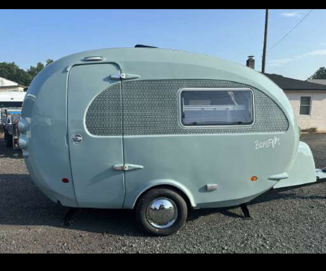 Light blue Barefoot vintage travel trailer, perfect for an RV rental adventure.