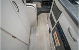 RV rental: Interior view of a galley/hallway with light flooring, cabinets, and a built-in microwave. Compact and functional.