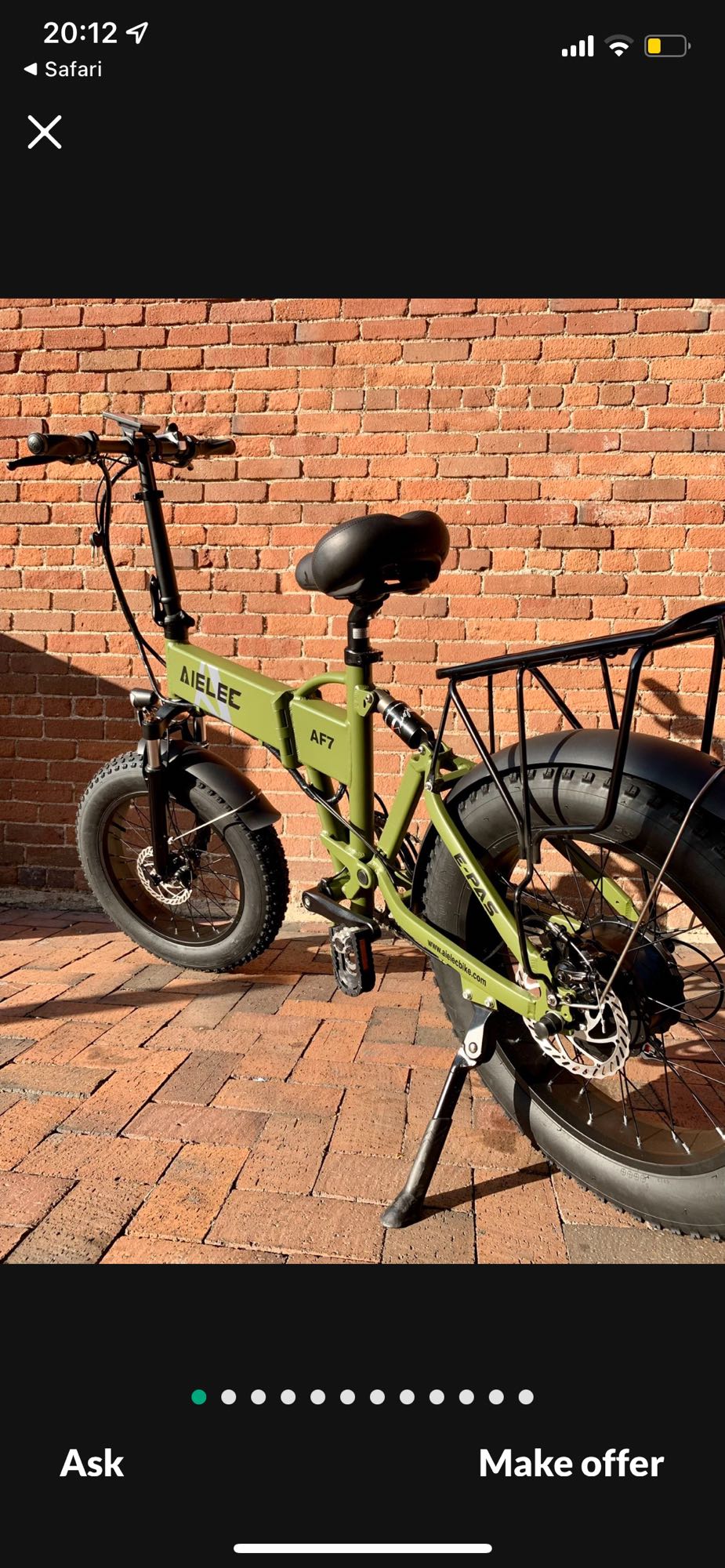 This green foldable fat-tire e-bike is compact, perfect for RV rental trips. It has a rear rack and disc brakes.