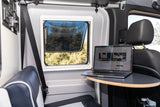 Inside an **rv rental**: a cozy camper van interior with a laptop on a table, displaying a Mercedes Sprinter van for rent.