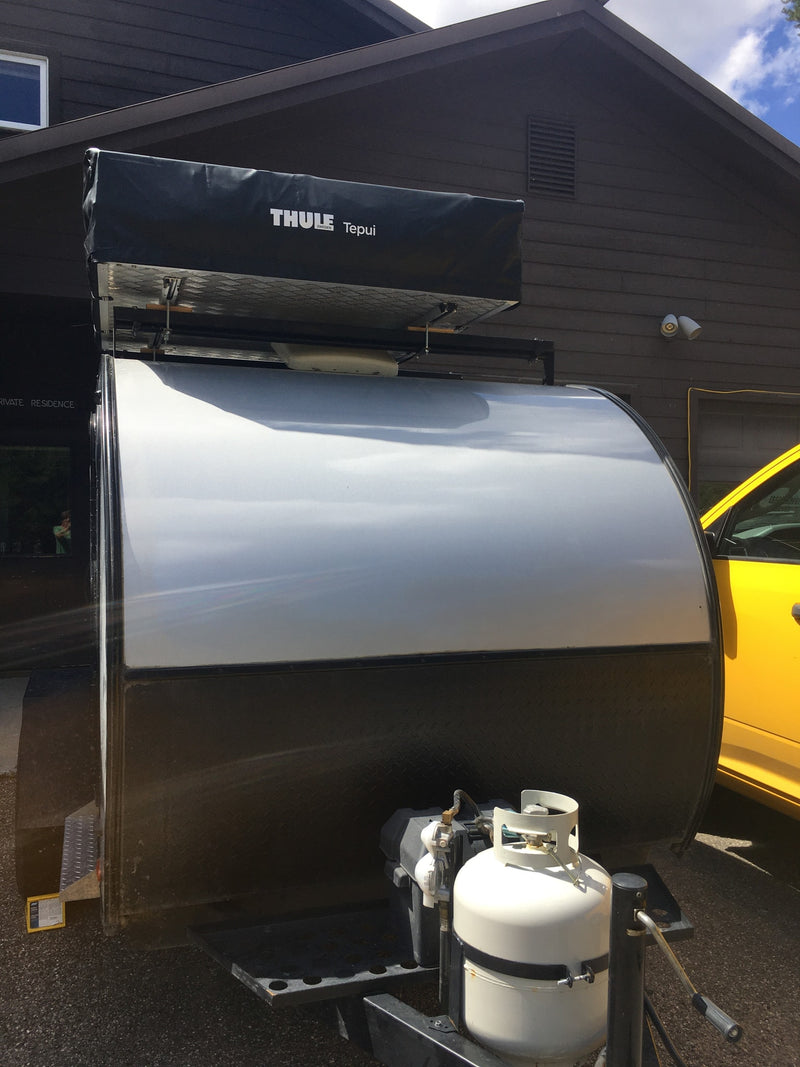 Teardrop RV rental: A compact trailer with a Thule Tepui rooftop tent and propane tank, ready for camping trips. — photo 3