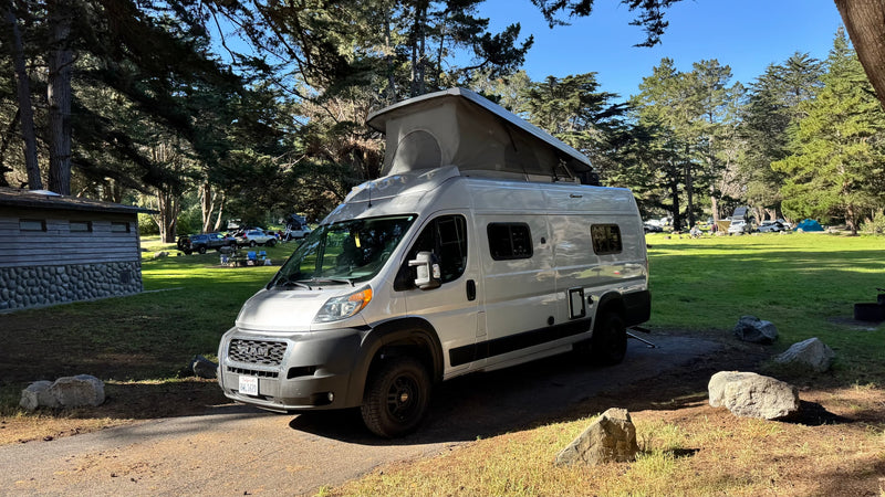  its side door open to reveal a compact interior setup.|This rv rental — photo 4