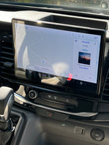 Inside an RV rental: The vehicle's large infotainment screen displays navigation, SiriusXM radio, and cabin climate controls.