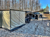 Overland ARB Touring teardrop camper and Jeep on gravel with tent. Ideal for RV rental adventures.