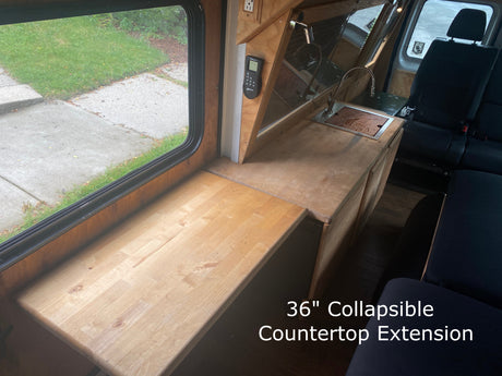 Optimize your RV rental space! View a 36" collapsible kitchen countertop extension, sink, and seating in a camper van.
