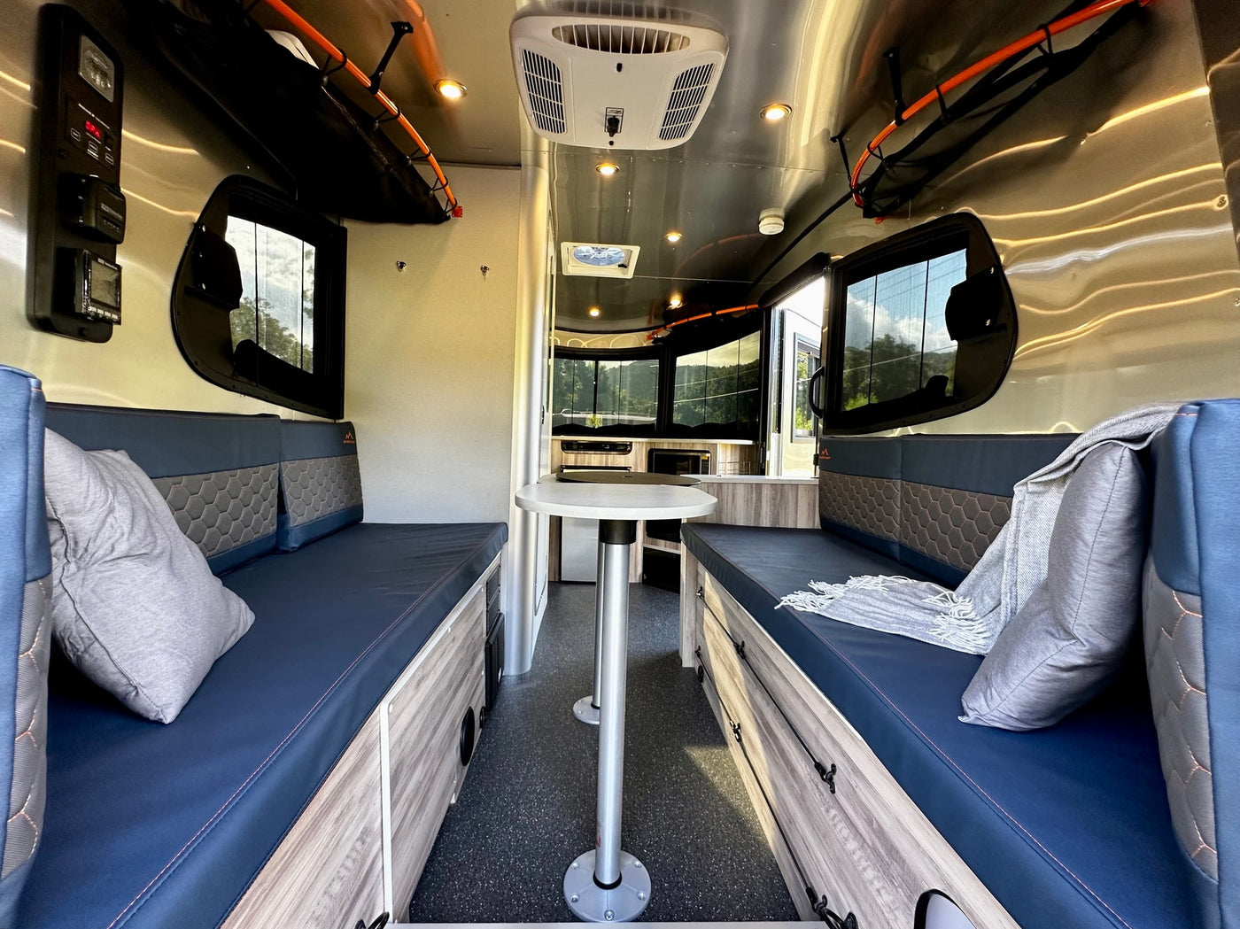  and safety fire extinguisher.|This RV rental interior features a compact kitchen with fridge — photo 9