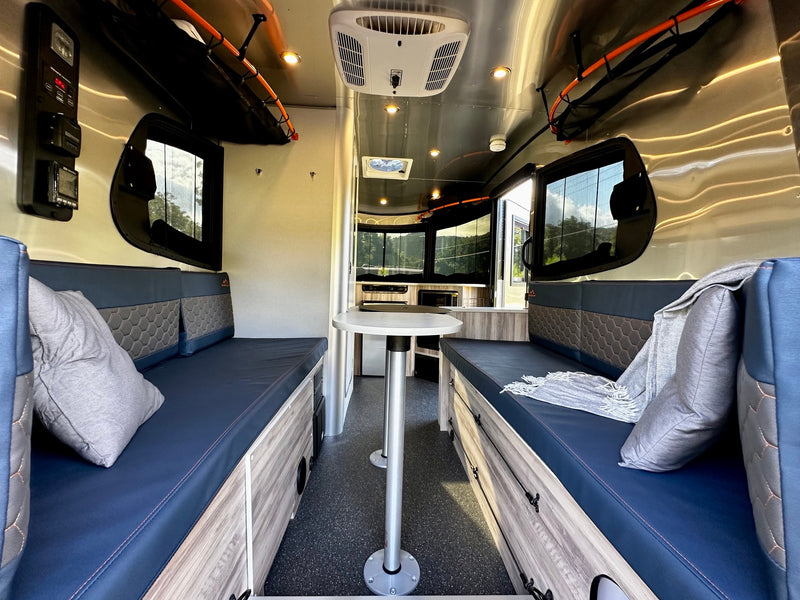 and safety fire extinguisher.|This RV rental interior features a compact kitchen with fridge — photo 9