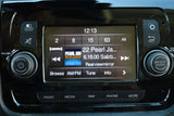 RV rental vehicle's infotainment system, displaying Pearl Jam Radio, with control buttons for volume, screen, and navigation.