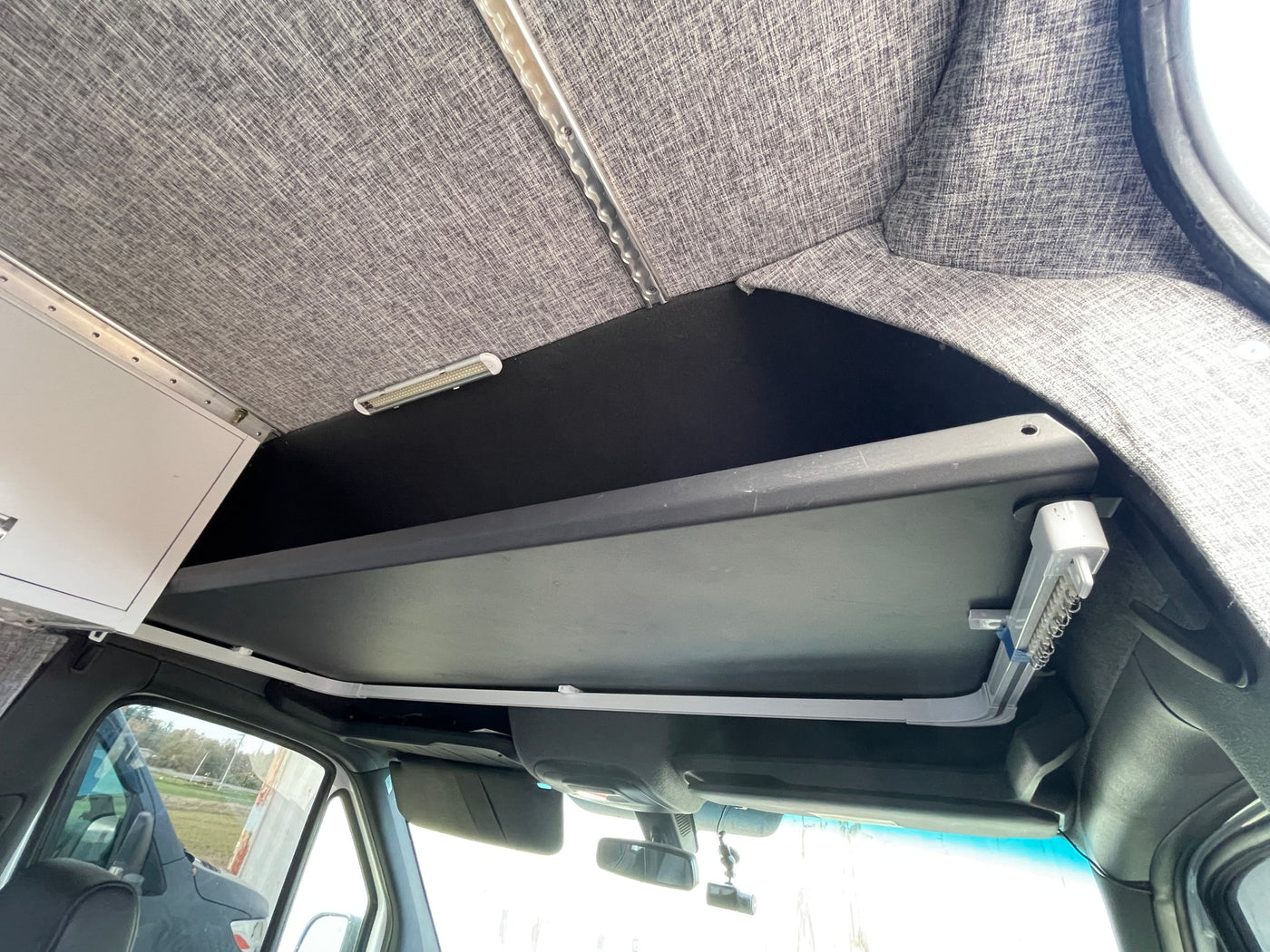  & clever storage in a modern design.|Compact rv rental bathroom featuring a shower — photo 10