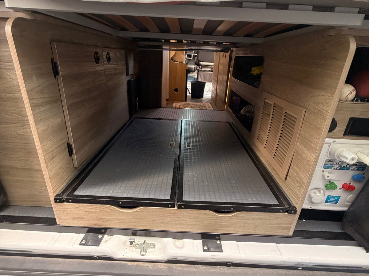  and detailed control panel.|RV rental interior: A compact kitchen with a two-burner stove (lid open — photo 13