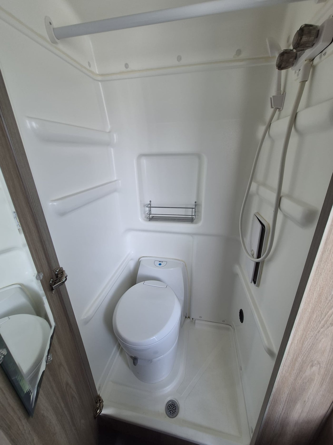  and umbrellas visible.|Inside an RV rental — photo 16
