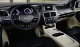 Dodge vehicle interior: detailed dashboard, steering wheel, and console. Ready for your comfortable RV rental trip.