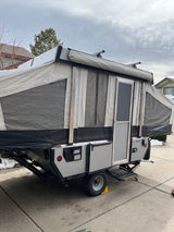 This pop-up RV rental is ready! Features a fabric body, door, Thule roof rack & ample space for adventures.
