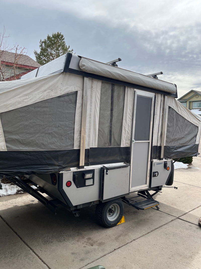This pop-up RV rental is ready! Features a fabric body, door, Thule roof rack & ample space for adventures. — photo 4