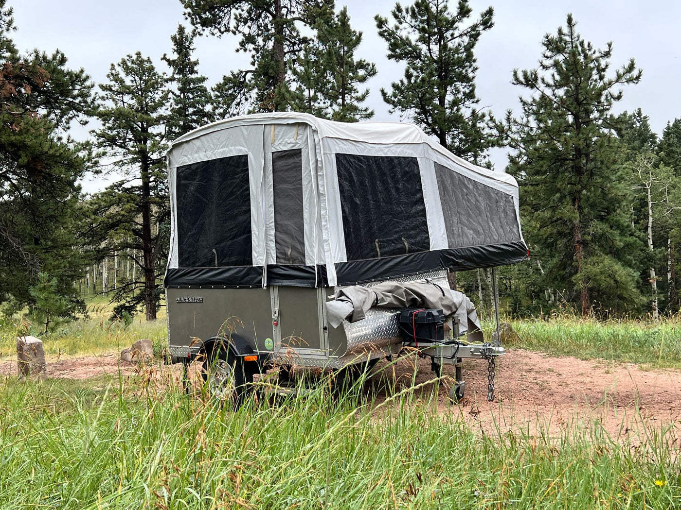  and outdoor views for camping and travel.|Inside a Quicksilver RV rental: cozy dinette area with table — photo 2