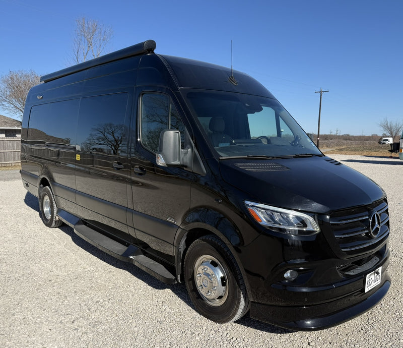 This sleek black Mercedes Sprinter van — photo 1