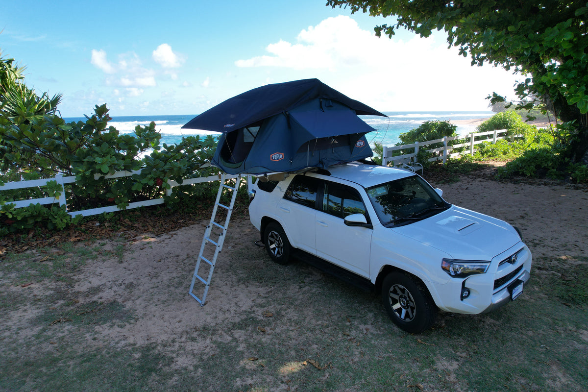 Experience beach camping! This white Toyota 4Runner with a rooftop tent provides a unique RV rental adventure by the ocean. — photo 5