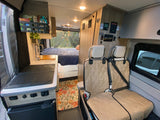 Experience van life in this rv rental! Features a full kitchen, comfortable bed, and versatile living area.