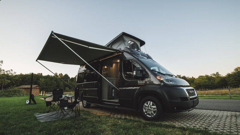 This RV rental camper van is set up for a relaxing campsite adventure — photo 1