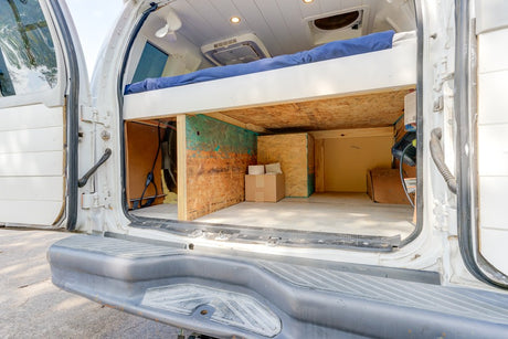 Spacious under-bed storage in a converted RV rental van, offering practical solutions for compact living and travel.