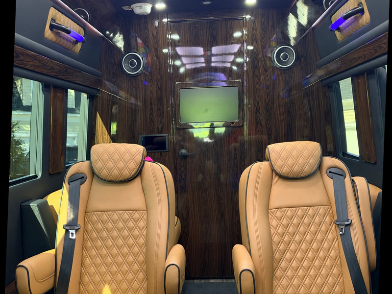  and wood trim for ultimate comfort.|Luxury RV rental interior showcasing two tan captain's chairs with diamond stitching — photo 10