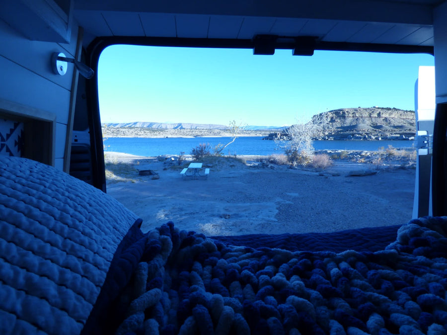 West Beach entrance.|White **RV rental** van at a scenic badlands park