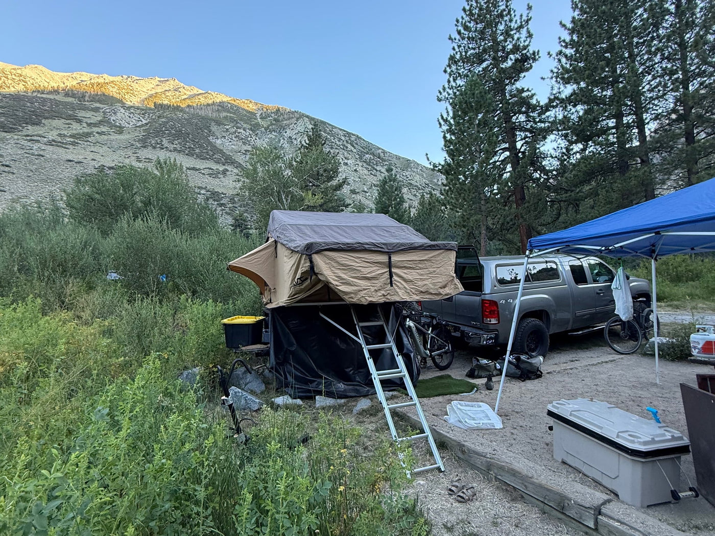  & picnic tables.|An RV rental setup: a truck with a rooftop tent — photo 8