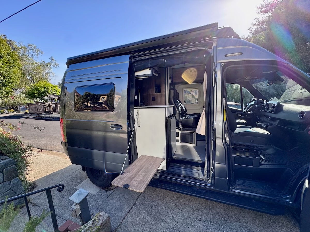  parked on a sunny street.|Grey Tiffin camper van — photo 5